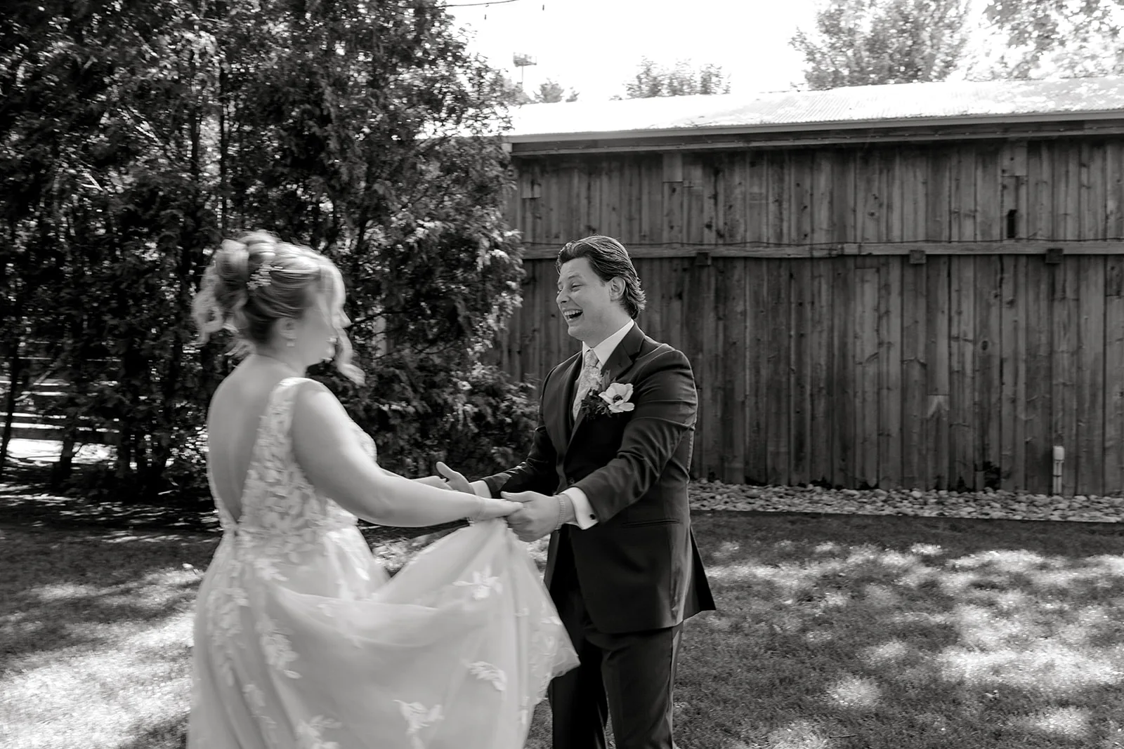 A couple moving together through a garden at Terrain at Styer's