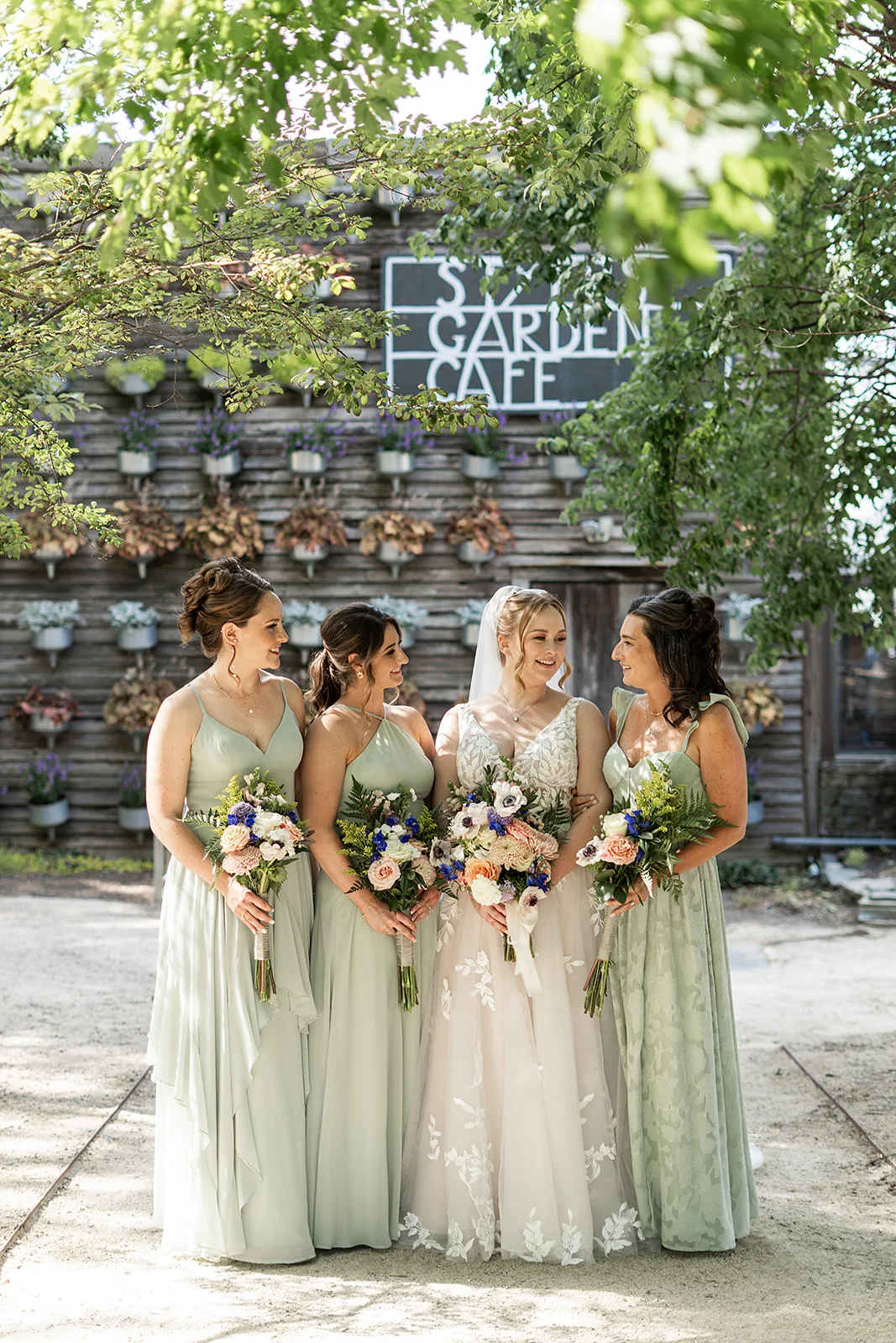A bride and her attendants outside the Garden Cafe at Terrain at Styer's